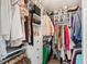 Walk-in closet featuring ample shelving and hanging storage for optimal organization at 4150 S Rome St, Aurora, CO 80018