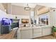 Bright living room with a fireplace, fish tank, and a view of the backyard at 4150 S Rome St, Aurora, CO 80018