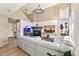 Bright living room with vaulted ceilings, fireplace, hardwood floors, and a decorative fish tank at 4150 S Rome St, Aurora, CO 80018