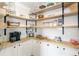 Pantry featuring wooden countertops, open shelves, and white subway tile backsplash at 4150 S Rome St, Aurora, CO 80018
