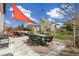 Inviting patio with comfortable seating, a shade sail, string lights, and outdoor dining area at 4150 S Rome St, Aurora, CO 80018
