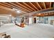Spacious unfinished basement with exposed beams and ample potential for customization at 2069 Garrison St, Lakewood, CO 80215