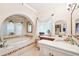 Gorgeous bathroom with a garden tub, marble countertops and decorative accents at 2069 Garrison St, Lakewood, CO 80215