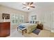 Cozy bedroom with a ceiling fan, natural light, and neutral decor at 2069 Garrison St, Lakewood, CO 80215