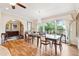 Bright dining room with large windows, chandelier, and hardwood floors at 2069 Garrison St, Lakewood, CO 80215