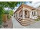 Charming front porch featuring arched columns and a welcoming entrance to the home at 2069 Garrison St, Lakewood, CO 80215