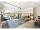 Spacious garage with ample storage, including shelving and room for equipment at 2069 Garrison St, Lakewood, CO 80215