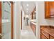 Elegant hallway features marble floors, recessed lighting, and custom cabinetry at 2069 Garrison St, Lakewood, CO 80215