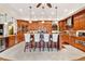 Gourmet kitchen features custom cabinets, a large island, and counter seating at 2069 Garrison St, Lakewood, CO 80215