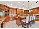Gourmet kitchen features custom cabinets, a large island, and granite countertops at 2069 Garrison St, Lakewood, CO 80215