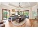Bright living room with a fireplace, hardwood floors, and sliding glass doors to the backyard at 2069 Garrison St, Lakewood, CO 80215