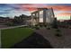 Modern home with stone accents, manicured landscaping, and an attached garage at 8290 Superior Cir, Littleton, CO 80125