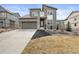 Beautiful two-story home with a modern design, stone accents, well-kept lawn, and a two car garage at 8290 Superior Cir, Littleton, CO 80125