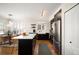A well-lit kitchen and dining area featuring stainless steel appliances and a central island at 111 S Monroe St # B104, Denver, CO 80209