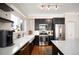 Well-equipped kitchen with stainless steel appliances, quartz countertops, and ample cabinet space at 111 S Monroe St # B104, Denver, CO 80209
