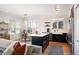 Bright, airy kitchen featuring a central island, stainless steel appliances, and an adjacent dining area at 111 S Monroe St # B104, Denver, CO 80209