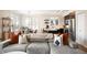 Inviting living room with a view of the modern kitchen and dining area at 111 S Monroe St # B104, Denver, CO 80209