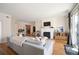 Spacious living room with a fireplace, balcony access, and stylish decor at 111 S Monroe St # B104, Denver, CO 80209