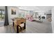 Finished basement featuring a foosball table, bay window, and a walkout to a patio at 404 Yarrow Pl, Castle Pines, CO 80108