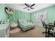 Charming bedroom with green walls, swing chair, and custom decor at 404 Yarrow Pl, Castle Pines, CO 80108