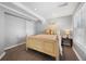 Basement bedroom with neutral walls, a queen bed, and bright window with a view of the exterior at 404 Yarrow Pl, Castle Pines, CO 80108