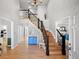 Grand foyer with a beautiful staircase, hardwood floors, and high ceilings at 404 Yarrow Pl, Castle Pines, CO 80108