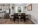 Bright dining room features a table with four chairs and stylish decor at 5529 Gray Wolf Ln, Castle Rock, CO 80104