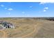 Wide aerial shot showcasing the surrounding landscape, with the house in the lower left corner at 15322 Irving Ct, Broomfield, CO 80023