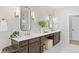 Bathroom showcasing a double vanity, large mirrors, and modern lighting at 15322 Irving Ct, Broomfield, CO 80023