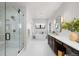 Spacious bathroom featuring a glass enclosed shower, soaker tub, and double vanity at 15322 Irving Ct, Broomfield, CO 80023