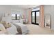 Cozy bedroom with large windows, a desk, and neutral decor at 15322 Irving Ct, Broomfield, CO 80023
