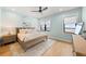 Comfortable bedroom with natural light, a ceiling fan, hardwood floors, and neutral decor at 15322 Irving Ct, Broomfield, CO 80023