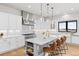 Spacious kitchen with marble countertops, stainless steel appliances, a large island, and hardwood floors at 15322 Irving Ct, Broomfield, CO 80023