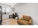 Cozy living area with comfortable seating, a desk setup, and ample natural light at 15322 Irving Ct, Broomfield, CO 80023