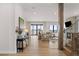 Spacious living room with hardwood floors, a fireplace, large windows, and views of the surrounding landscape at 15322 Irving Ct, Broomfield, CO 80023
