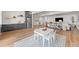 Open living space with modern kitchen, dining area, and cozy living room, perfect for entertaining at 15322 Irving Ct, Broomfield, CO 80023