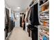 Walk-in closet with custom shelving and ample storage space for clothes and shoes at 15322 Irving Ct, Broomfield, CO 80023