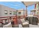 Relaxing outdoor balcony with comfortable seating, patio furniture, and views of surrounding buildings at 1767 N Pearl St # 308, Denver, CO 80203