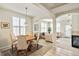 Open-concept dining area and living room offering abundant natural light and stylish decor throughout at 1767 N Pearl St # 308, Denver, CO 80203