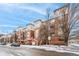 Attractive multi-story apartment complex with red brick facade and well-maintained landscaping at 1767 N Pearl St # 308, Denver, CO 80203