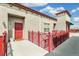Apartment unit entry with red door and red rails at 1767 N Pearl St # 308, Denver, CO 80203