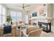 Bright living room with a fireplace, stylish furnishings, and an open layout at 1767 N Pearl St # 308, Denver, CO 80203
