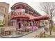 Whimsical restaurant exterior with colorful murals and outdoor seating area at 1767 N Pearl St # 308, Denver, CO 80203