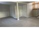 Spacious finished basement with neutral carpeting and ample storage at 3062 S Florence Ct, Denver, CO 80231