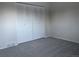 Bedroom with grey carpet and double door closet at 3062 S Florence Ct, Denver, CO 80231