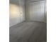 Bedroom with grey carpet and double door closet at 3062 S Florence Ct, Denver, CO 80231