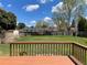 Backyard deck with a lush green lawn and beautiful sunny skies at 3062 S Florence Ct, Denver, CO 80231