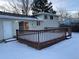 Large deck overlooks the backyard, providing ample outdoor space at 3062 S Florence Ct, Denver, CO 80231