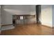 Living room with hardwood floors and staircase to upper level at 3062 S Florence Ct, Denver, CO 80231