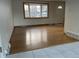 Bright living room featuring hardwood floors and a large bay window at 3062 S Florence Ct, Denver, CO 80231